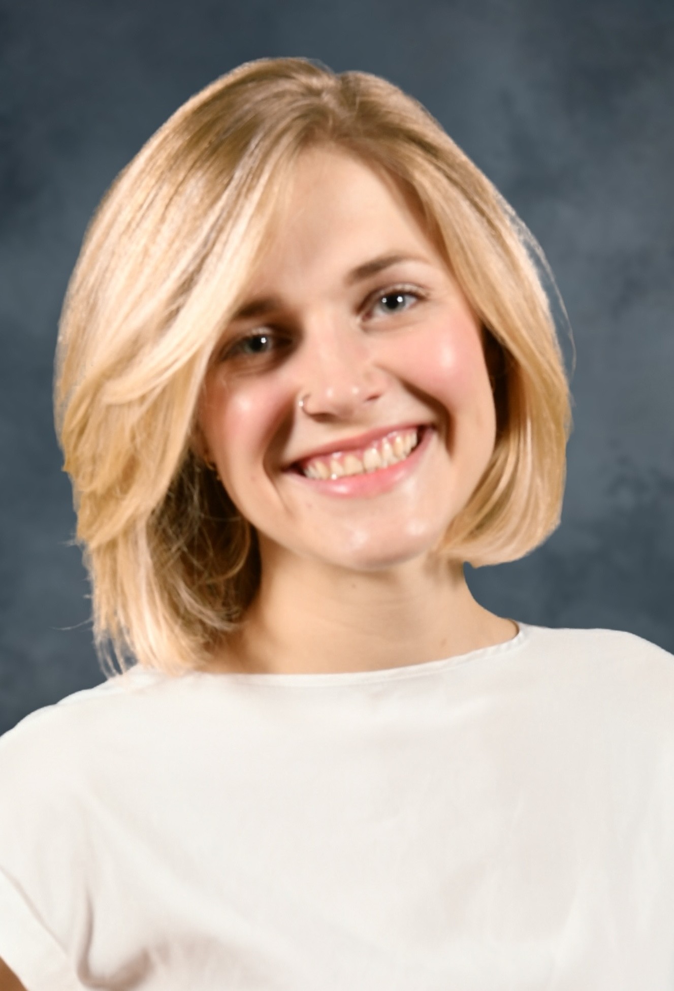 photo of smiling female with blond hair
